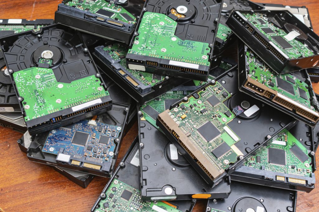 Obsolete hard drives piled up for recycling
